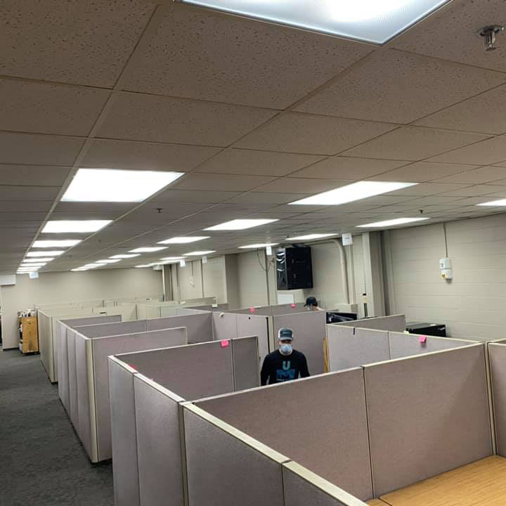 planningAnOfficeMove During an office move, the Unique Movers team works on moving a section of cubicles near Sartell, MN.