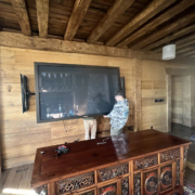 The Unique Movers team helps move a television.