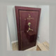 A large maroon gun safe that has been moved.
