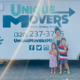 A smiling family that just got done moving.