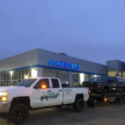 A Unique Movers truck transporting a customer’s vehicle.