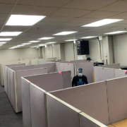 Office movers cleaning out cubicles during an office move.