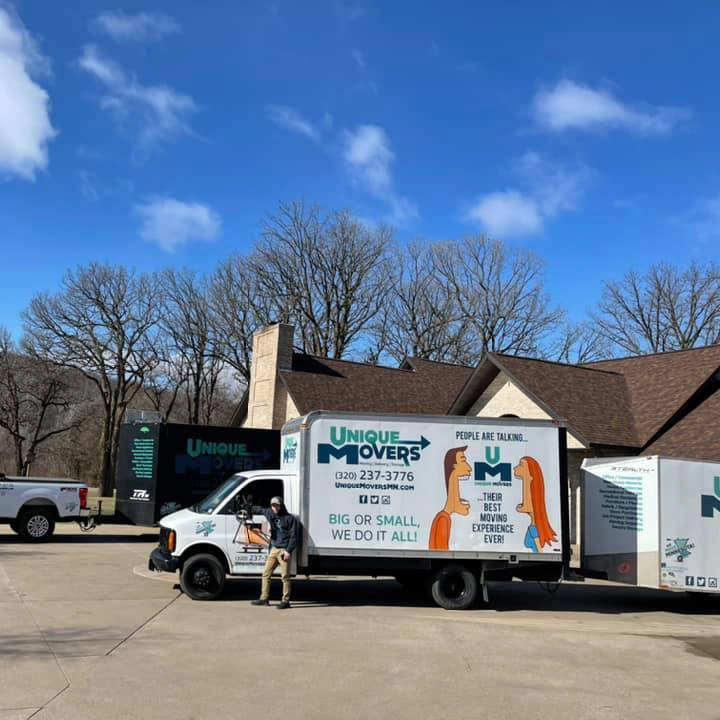 A bedroom neatly packed up with boxes for moving.
